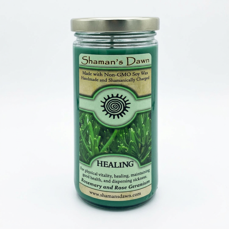 Healing Candle with green wax and silver lid on a clean white background
