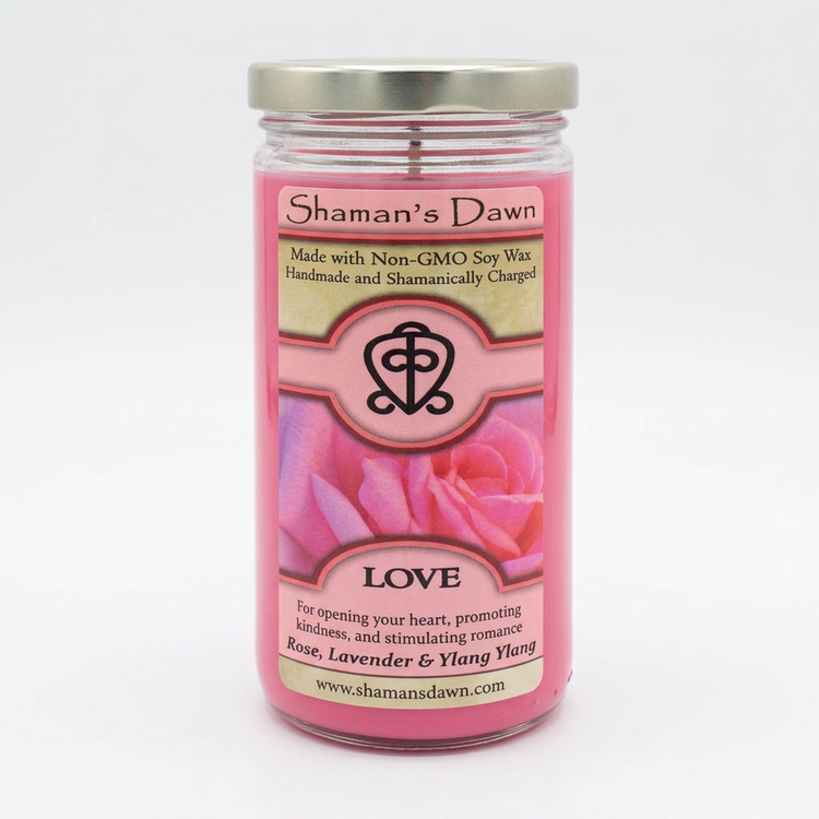 Love Candle with pink wax and silver lid on a clean white background
