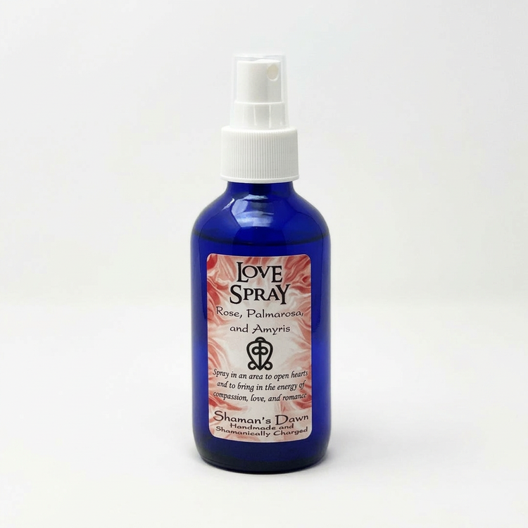 Love Spray cobalt blue bottle with white spray pump on a clean white background