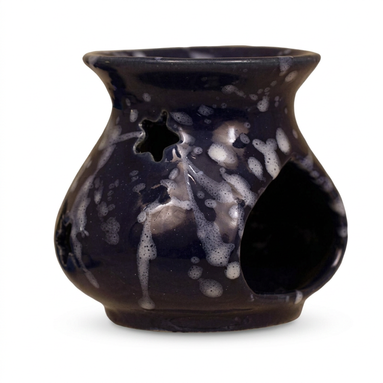 Small dark ceramic oil and wax warmer with white speckles and star cutout